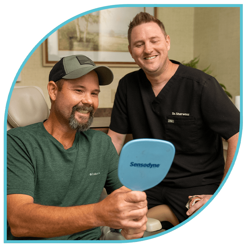 Doctor and Patient smiling in a mirror