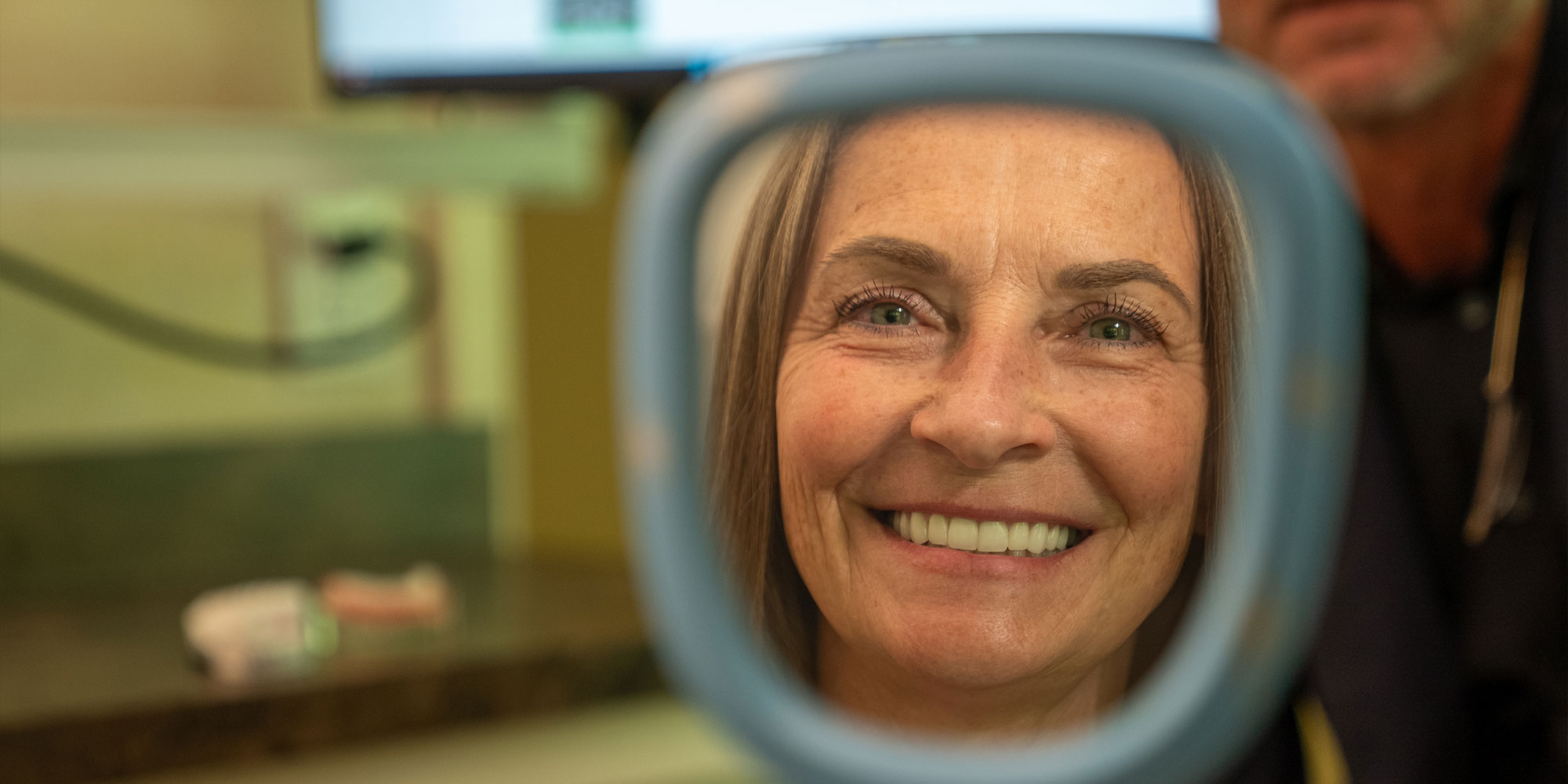Woman Smiling in mirror