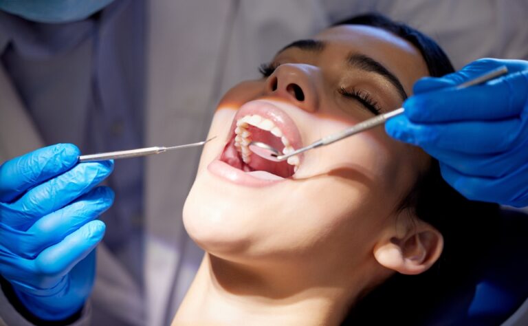 Patient in dentist office in Conway, AR discussing treatment options.